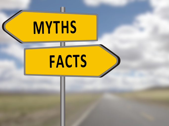 Road sign showing “myths” and “facts” directions, representing common charitable giving myths and how donors can make informed decisions