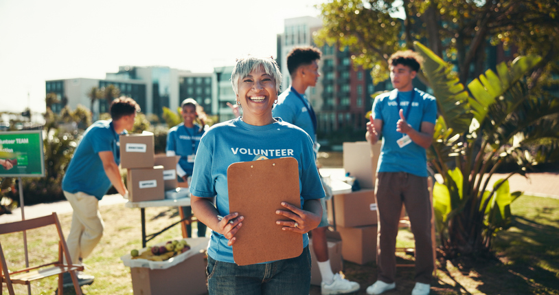 Volunteer team organizing boxes, showing how volunteering supports local communities