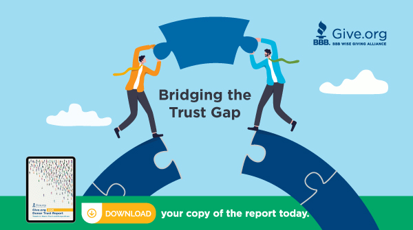 Illustration of two people placing a puzzle piece over a gap with the words “Bridging the Trust Gap,” promoting the Give.org Donor Trust Report 2026.