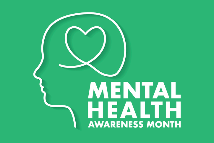 Graphic of a head outline with a heart for Mental Health Awareness Month, representing mental wellness, community support, and trusted mental health charities.